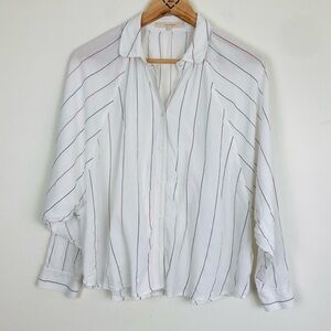 Sacrecoeur striped button front shirt with raglan sleeves and boxy fit. Small
